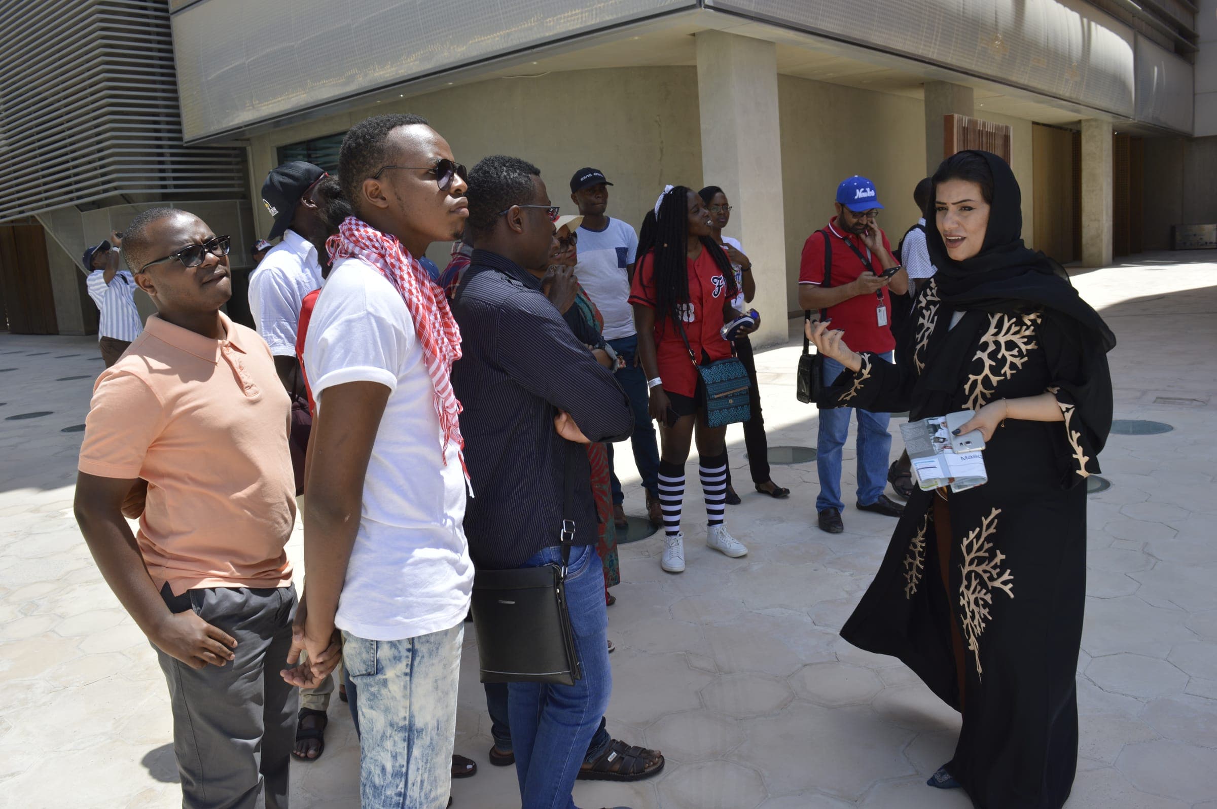Kenyan students listen to a guide on a study visit in the United Arab Emirates