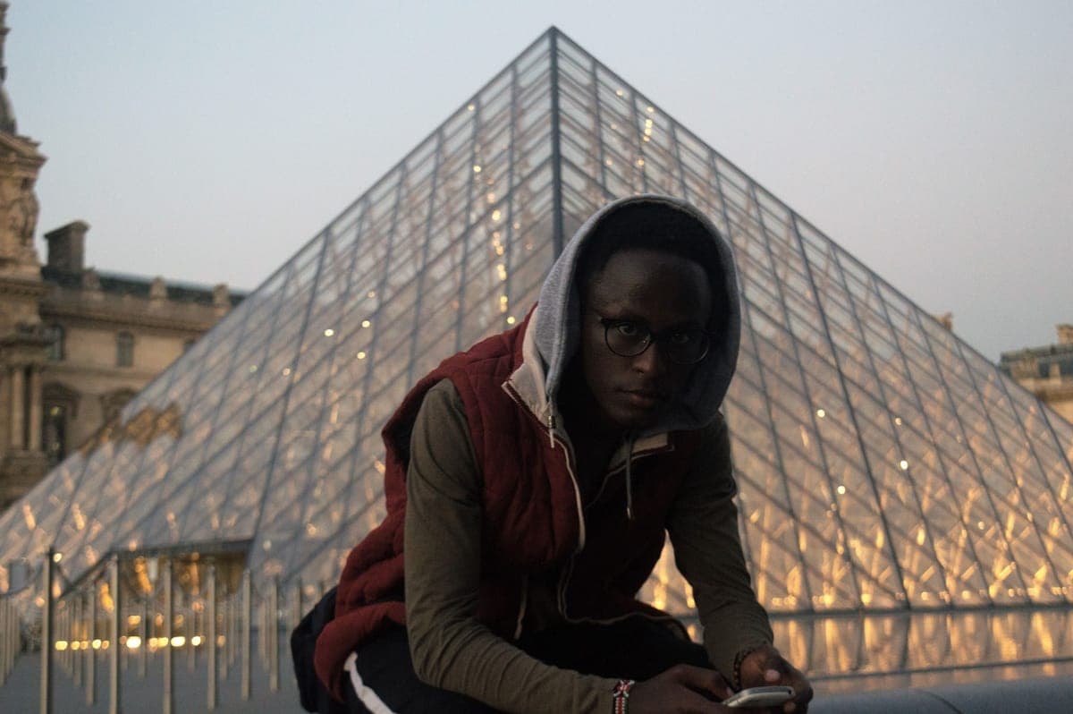 A ReadTrips student at the Louvre pyramid in Paris
