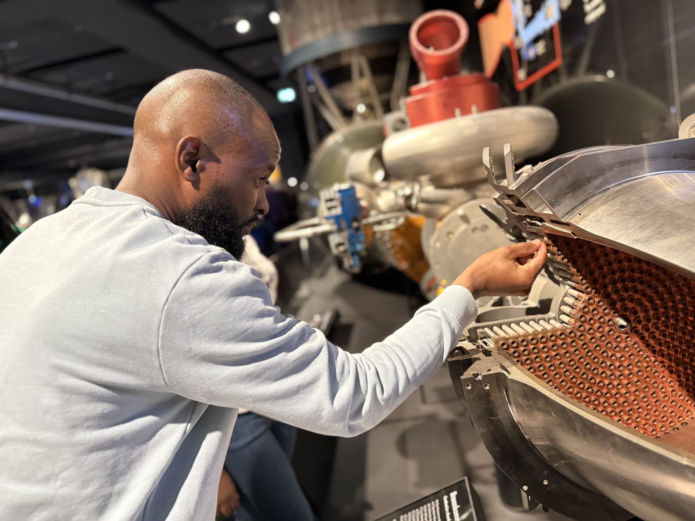 A ReadTrips traveller examines a space engineering exhibit at a science museum in Europe
