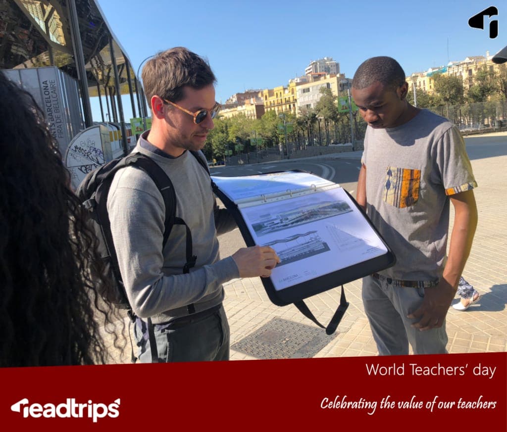 A guide showing architectural drawings to a student in Barcelona, on a ReadTrips World Teachers' Day card