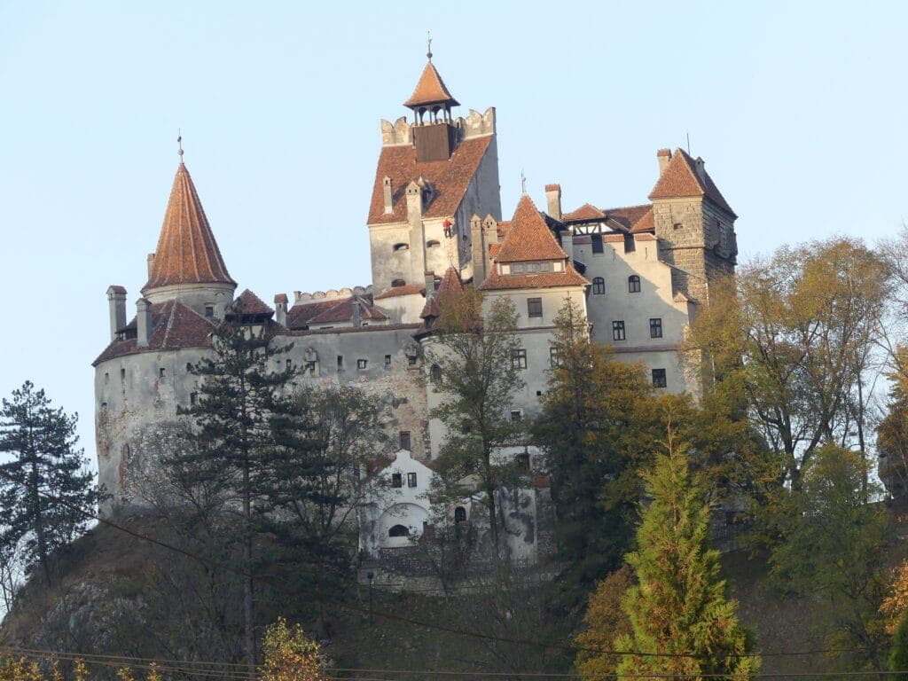 Bran Castle on its wooded hilltop in Romania
