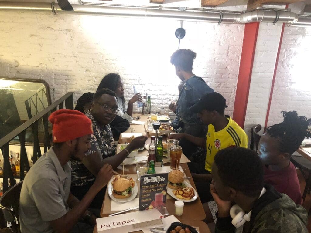 A student group sharing a meal at a tapas restaurant